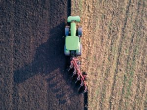 Propane tractor plowing field