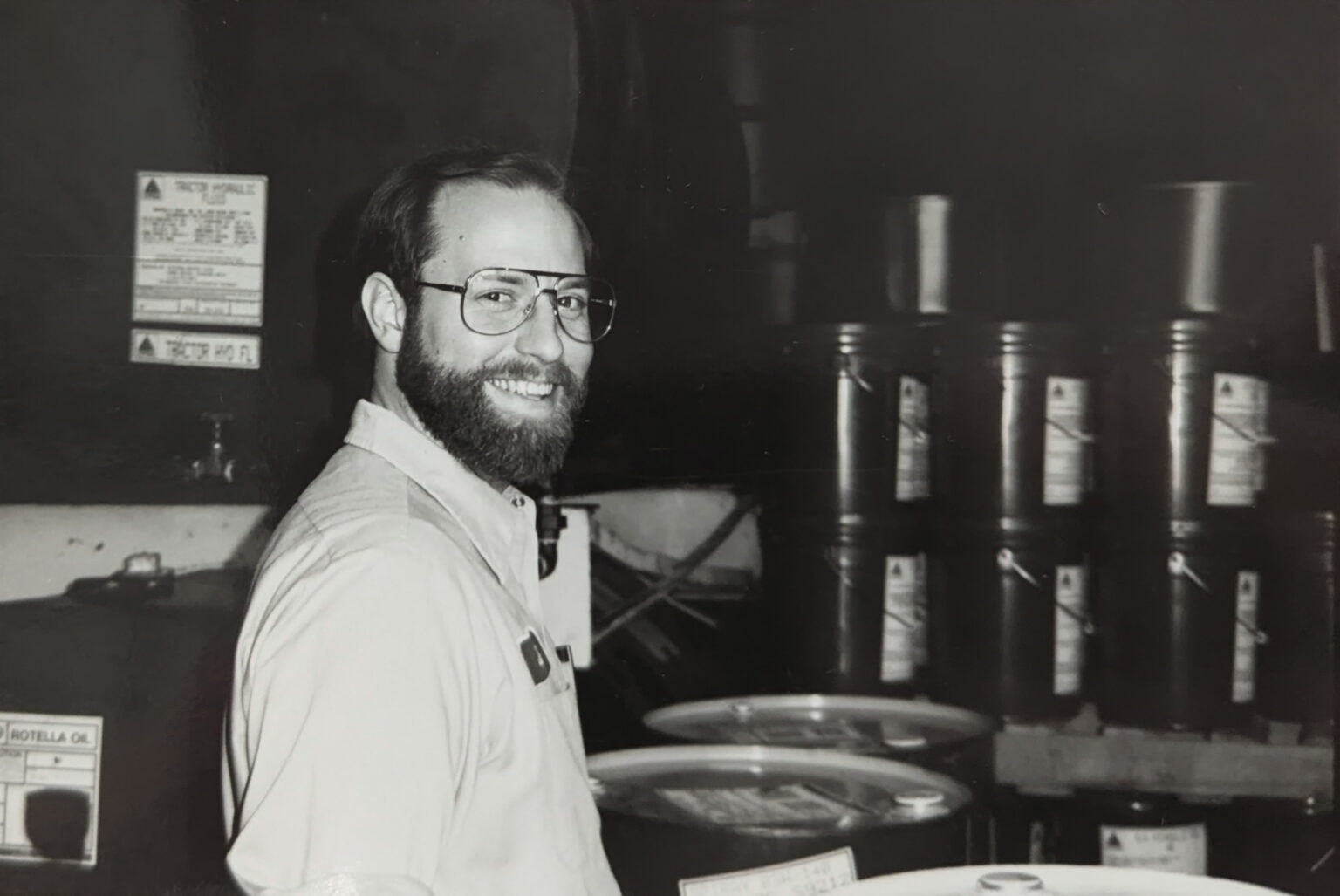 Jim Tefft standing near oil